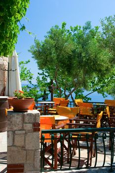 Open-air greek cafe terrace overlooking the sea gulf