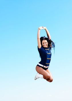 dancer jumping on a background of blue sky