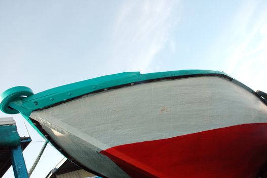 a new large wooden ship that was leaning against receding sea