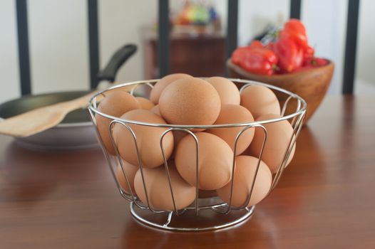 Farm fresh brown eggs in a basket.