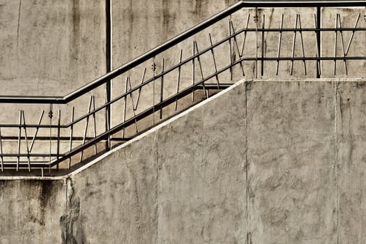 Gray concrete stairway with metal railing 