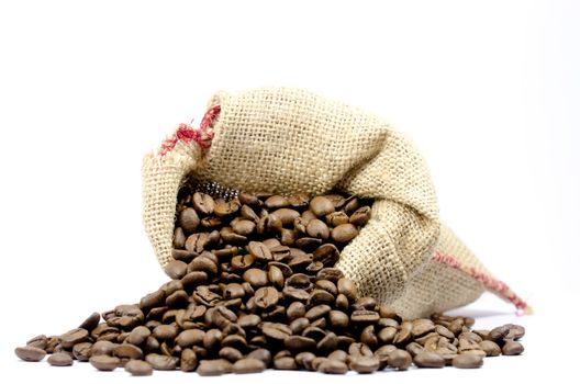 coffee beans in a burlap bag on white background