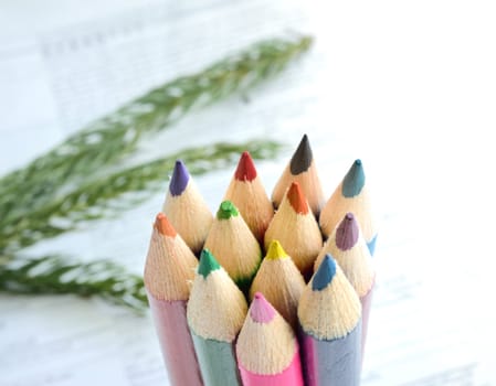 Upright wooden crayons.