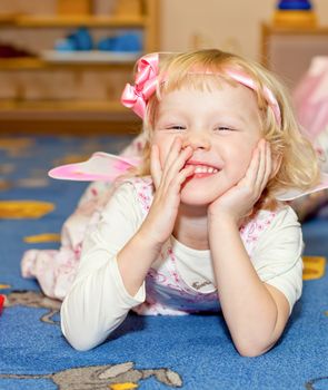 Happy little girl playing at nursery