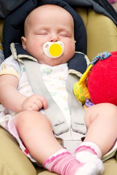 Four month infant sleeping in a car seat