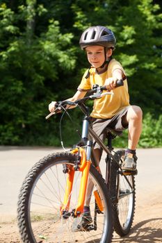 Young boy riding bicycle, shallow dof