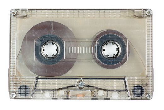 Used vintage transparent Compact Cassette on white background