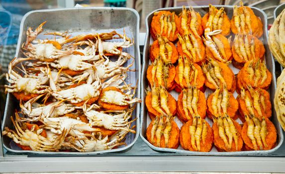 Spicy flat cakes with crabs and prawns on dishes in Colombo city, Sri Lanka