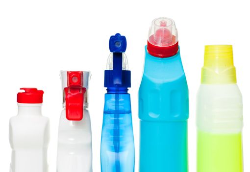 Cleaning supplies in a row on white background