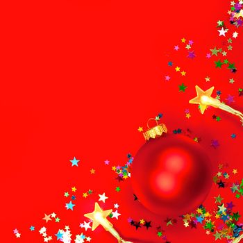 Christmas bauble with star-shaped lights on red background, shallow DOF