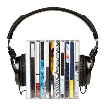 HI-Fi headphones on stack of CDs on white background