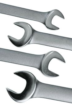 Set of chrome lug wrenches on white background