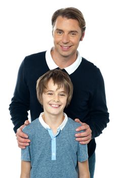 Stylish man in blue pullover posing with his smiling son. Isolated over white.