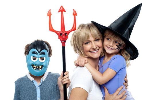 Mom with son and daughter. Halloween dress up. All against white background.