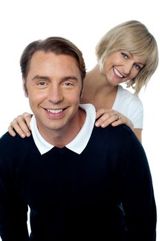 Love couple posing casually in front of camera. All against white background.