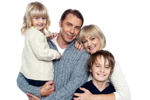 Family portrait of a couple with their two children. Isolated over white.