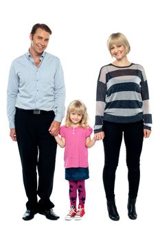 Cute daughter holding hands of her parents tightly. Full length studio shot.