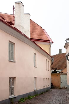 Old pink and yellow buildings in Tallinn
