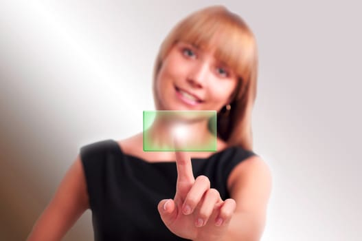 beautiful woman presses a button touch screen