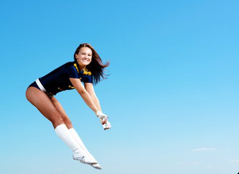 dancer jumping on a background of blue sky