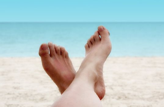 Sandy Woman Feet on a Tropical Beach