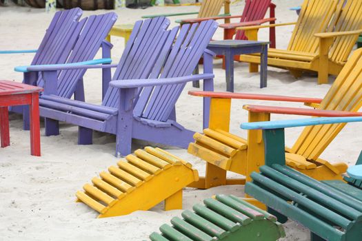 Colorful Adirondack Wooden Chairs on the Beach