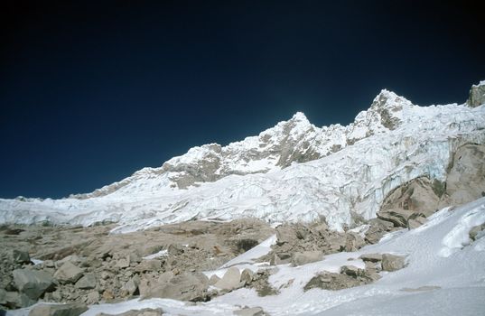 Barren wasteland landscape of snow and stone high in Peruvian Andes Mountains