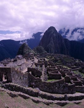 Beautiful historic lost Inca city Machu Picchu with Andes Mountains in background