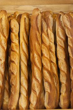 Bread baguettes standing up in a French bakery or boulangerie