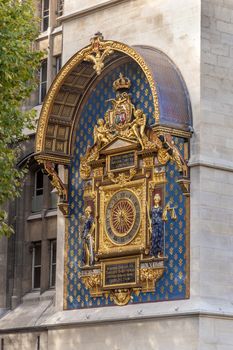 Wall clock on the corner of the Palais de Justice in Paris, France. It is about 14 feet high.