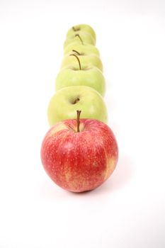 apples arranged on a white background to symbolize teamwork, leadership, discrimination.