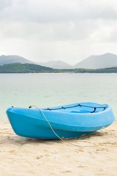 Blue canoe on beach,Phuket Thailand