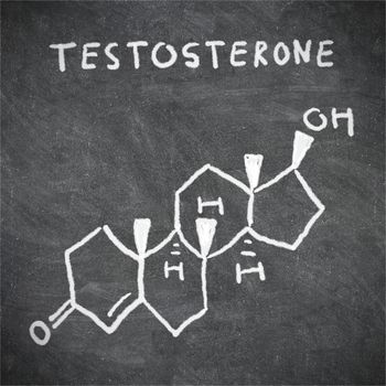 Testosterone chemical structure formula written on blackboard with chalk.