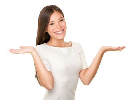 Showing woman - two hands empty for product or text. Casual woman isolated on white background. Multi-racial Caucasian / Asian female model smiling happy.
