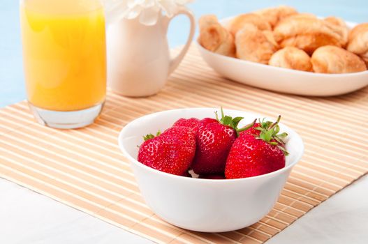 Breakfast with berries,orange juice and croissant, early breakfast