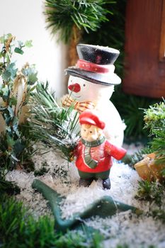 Antique Snowman on the Window Sill decorated with Fir Branch