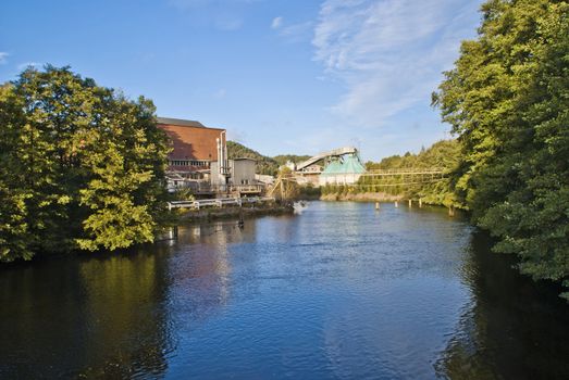 paper mill in Halden (Norway) which is the oldest wood processing plant in Norway, image is shot from the Tista river that flows past the factory. 