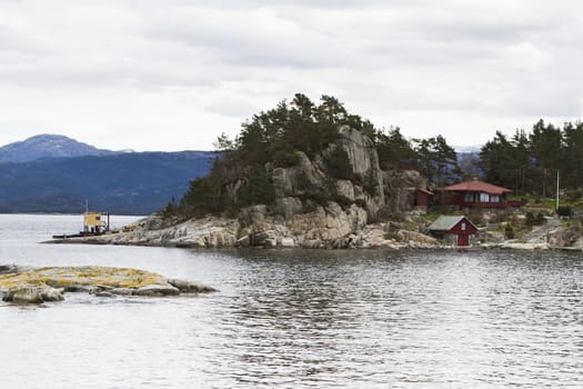 house at coastline on small island in norway