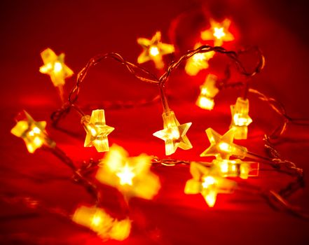 Star shaped Christmas light with blured background, very shallow DOF