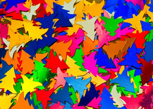 Multicolored Christmas tree shaped confetti backgroud