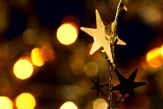 Christmas decoration with blurred lights in background, shallow DOF