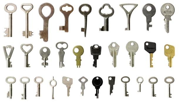 Collection of old keys on white background