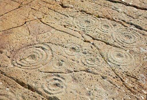 Cup and ring marks on a stone near Cairnbaan in Scotland