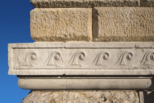 Ancient wall in sandstone and marble with decorations in Verona - Italy