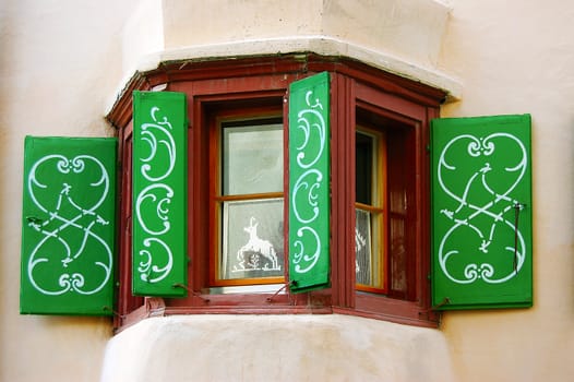 Detail of a typical window with decorations in Engadine - Switzerland