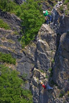 BRISTOL, ENGLAND - JUNE 20: Climbers on a rock face in the Avon Gorge in Bristol, England on June 20, 2010. The mutual reliance of the participants in this hazardous pastime is self-evident