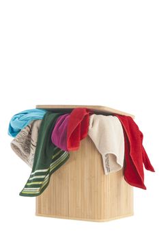 colorful towels in a basket isolated on white background 