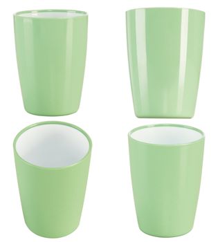 four point of view from green plastic glass for juice, isolated on white background.