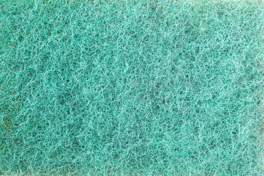 closeup of green spunge for cleaning pans