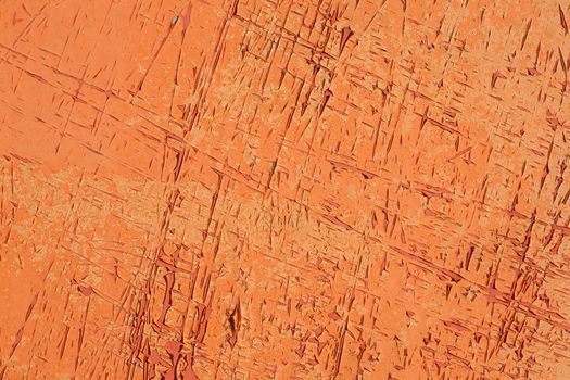 abstract pattern of scratches on pattern of old orange and red paint